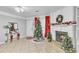 Warm living room featuring a fireplace, festive holiday decor, and ample natural light at 3109 Meadow Wood Ct, Lawrenceville, GA 30044