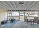 Covered patio with painted floor and white beamed ceiling with view of playground at 3109 Meadow Wood Ct, Lawrenceville, GA 30044