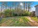 Expansive backyard with mature trees, providing privacy and shade, plus a convenient staircase to upper deck at 6106 Misty Valley Se Dr, Acworth, GA 30102