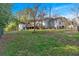 View of the back of the home showing the deck, screened-in porch, and fenced in backyard on a well maintained lot at 6106 Misty Valley Se Dr, Acworth, GA 30102