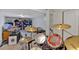 Partially finished basement showcases a drum set, offering potential for a music room or recreational area at 6106 Misty Valley Se Dr, Acworth, GA 30102