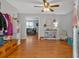 Inviting entryway featuring hardwood floors, a ceiling fan, and a view into the spacious living area at 6106 Misty Valley Se Dr, Acworth, GA 30102