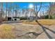 Spacious lot with multiple outbuildings and large front yard provides ample space and opportunities at 6106 Misty Valley Se Dr, Acworth, GA 30102