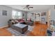 Bright living room features hardwood floors, a large gray sectional, and natural light at 6106 Misty Valley Se Dr, Acworth, GA 30102