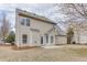 An exterior view of the rear of the home with siding and a small patio in the backyard at 2341 Walnut Tree Ct, Buford, GA 30519