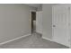 Neutral bedroom with carpet, a large closet, and natural light from the hallway at 2341 Walnut Tree Ct, Buford, GA 30519