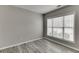 Neutral bedroom featuring hardwood floors, natural light, and ample closet space at 2341 Walnut Tree Ct, Buford, GA 30519