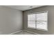 Bright bedroom with neutral walls and carpet, and a large window for natural light at 2341 Walnut Tree Ct, Buford, GA 30519