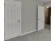 Bedroom featuring neutral walls, carpet, and a large closet at 2341 Walnut Tree Ct, Buford, GA 30519