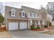 Charming two-story home featuring a two-car garage, brick accents and a welcoming front porch at 2341 Walnut Tree Ct, Buford, GA 30519