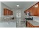 Modern kitchen featuring stainless steel appliances, granite countertops, and wooden cabinets at 2341 Walnut Tree Ct, Buford, GA 30519