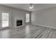 Living room featuring a fireplace, hardwood floors, and a glass door leading to outdoor space at 2341 Walnut Tree Ct, Buford, GA 30519