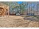 Large grassy backyard features a play set, storage shed, and trampoline, ideal for Gathering fun and outdoor activities at 79 Nimblewood Trl, Acworth, GA 30101