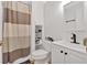 Bathroom featuring a shower with curtain, built-in shelves, toilet, and vanity at 79 Nimblewood Trl, Acworth, GA 30101