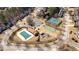 Aerial view of community amenities: pool, playground, parking, tennis court, and basketball court in a suburban neighborhood at 79 Nimblewood Trl, Acworth, GA 30101