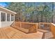 The deck and outdoor spaces feature plenty of room to sit and enjoy a backyard full of mature trees and green space at 79 Nimblewood Trl, Acworth, GA 30101