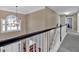 Bright upper hallway with natural light from the arched window at 79 Nimblewood Trl, Acworth, GA 30101