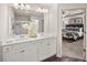 Bathroom featuring a double vanity, glass enclosed shower, and an entrance to the main bedroom at 1340 Magnolia Bend Way # 288, Jonesboro, GA 30238