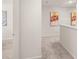 Upstairs hallway with neutral walls, carpet, and decorative wall art at 1340 Magnolia Bend Way # 288, Jonesboro, GA 30238
