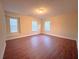 Large bedroom with multiple windows and hardwood floors at 2098 Cutleaf Creek Rd, Grayson, GA 30017