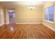 Elegant dining room featuring hardwood floors, large windows, and a chandelier at 2098 Cutleaf Creek Rd, Grayson, GA 30017
