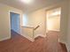 Upstairs hallway with hardwood floors and white trim at 2098 Cutleaf Creek Rd, Grayson, GA 30017