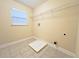A laundry room with a window and wire shelf at 2098 Cutleaf Creek Rd, Grayson, GA 30017