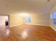 Bright and airy living room featuring hardwood floors and a stylish chandelier at 2098 Cutleaf Creek Rd, Grayson, GA 30017