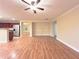 Spacious living room showcasing hardwood floors and an open layout to the kitchen area at 2098 Cutleaf Creek Rd, Grayson, GA 30017