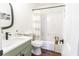 Cozy bathroom with a shower-tub, sleek vanity, and modern fixtures in a well-lit space at 2121 Lindley Nw Ln, Kennesaw, GA 30144