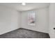Well lit bedroom features gray carpet, a large window and neutral colors at 2121 Lindley Nw Ln, Kennesaw, GA 30144