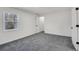 Neutral bedroom with gray carpet and large window for plenty of natural light at 2121 Lindley Nw Ln, Kennesaw, GA 30144