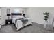 Comfortable bedroom with plush carpeting, neutral decor, and ample natural light at 2121 Lindley Nw Ln, Kennesaw, GA 30144