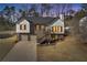 Exterior shot of a charming home with an inviting front entrance and a well-maintained lawn at 2121 Lindley Nw Ln, Kennesaw, GA 30144