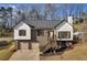 Charming home featuring a neatly manicured front yard and welcoming entrance staircase at 2121 Lindley Nw Ln, Kennesaw, GA 30144