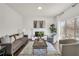 Cozy living area featuring a fireplace, hardwood floors, and large windows at 2121 Lindley Nw Ln, Kennesaw, GA 30144
