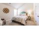 Bright bedroom featuring a queen-sized bed, neutral walls and a cozy chair at 123 Maplewood Ln, Conyers, GA 30094