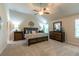 Spacious main bedroom with neutral carpet, fan and high ceiling at 123 Maplewood Ln, Conyers, GA 30094