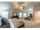 Spacious main bedroom with neutral carpet, fan, high ceilings and furniture at 123 Maplewood Ln, Conyers, GA 30094