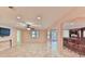 Basement area with tile flooring, a ceiling fan, and a wet bar for entertaining at 1230 Mars Hill Nw Rd, Acworth, GA 30101