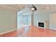 Serene bedroom featuring tray ceiling, hardwood floors, and a cozy fireplace at 1230 Mars Hill Nw Rd, Acworth, GA 30101