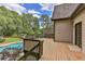 Spacious wooden deck overlooks a lush backyard with mature trees and a sparkling pool at 1230 Mars Hill Nw Rd, Acworth, GA 30101