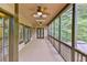 Relaxing covered patio featuring ceiling fans and a view of the wooded backyard at 1230 Mars Hill Nw Rd, Acworth, GA 30101