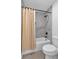 Clean bathroom featuring a shower, bathtub, toilet, and tiled walls at 133 Old Alabama Se Rd, Emerson, GA 30137