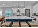 Bright kitchen featuring a marble island, white cabinets, and stainless steel appliances at 133 Old Alabama Se Rd, Emerson, GA 30137