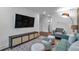 Living room featuring mounted television, side chair, and center ottoman seating at 133 Old Alabama Se Rd, Emerson, GA 30137