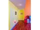 Hallway with bright colors and lovely red wood laminate floors at 2809 Arendel Dr, Lawrenceville, GA 30044