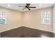 Bedroom with hardwood floors, neutral color walls, and plenty of natural light at 2995 Redwine Rd, East Point, GA 30344