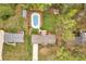 An aerial view of a home featuring a backyard pool, a shed, and ample greenery at 3046 Wendgate Dr, Marietta, GA 30062
