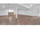 Spacious basement with wood-look flooring, white walls, and recessed lighting at 3046 Wendgate Dr, Marietta, GA 30062